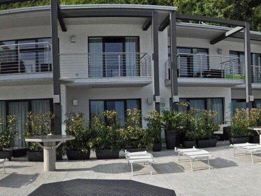 Acetaia del Balsamico Trentino B&B Agriturismo exterior view of the building with balconies, tables, chairs and potted plants