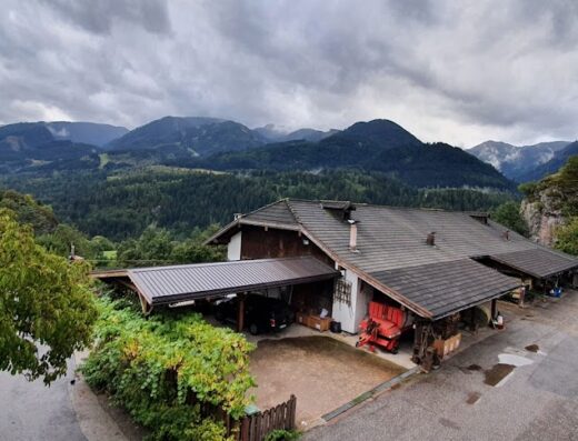 Agritur Chelodi, a farmhouse apartment in Val di Fiemme, Trentino Dolomites, with a view of the mountains and a rural landscape, perfect for a farm vacation in Val di Fiemme.