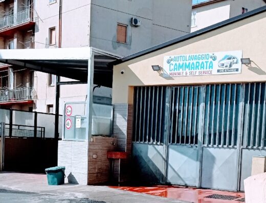 Autolavaggio Cammarata building featuring manual and self-service car wash options in an urban setting.