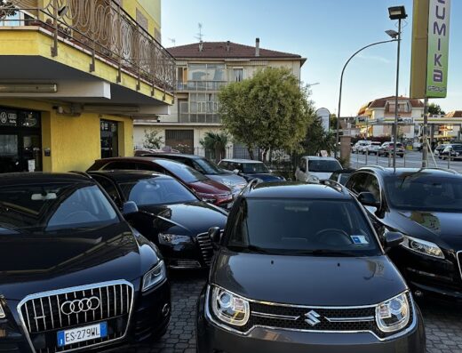 Showcase of Lumika Group car rental fleet, featuring Audi SUVs and Suzuki cars parked outside the rental location. Perfect for travel, excursions, or business trips.