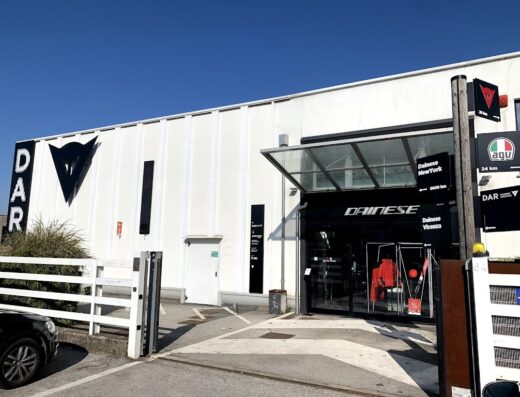 Dainese Store Vicenza: exterior view of the motorcycle apparel and accessories shop, showcasing Dainese and AGU signage. Find motorcycle gear and services here.