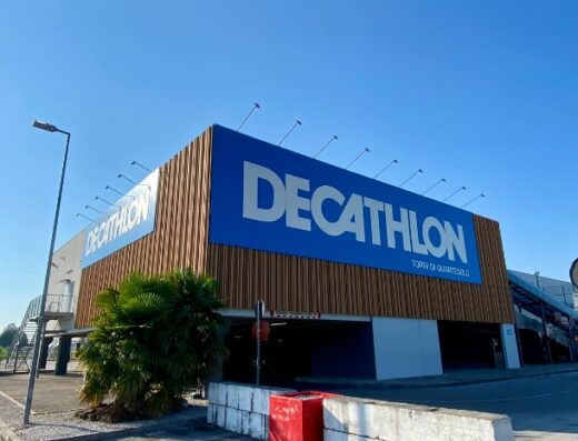 Decathlon Torri di Quartesolo store exterior, featuring the blue Decathlon logo on a modern building with wooden accents.