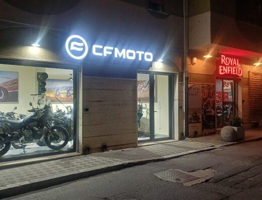 Showcase of motorcycle dealerships featuring CFMOTO and Royal Enfield, offering a marketplace for motorcycle sales, travel, and accessories