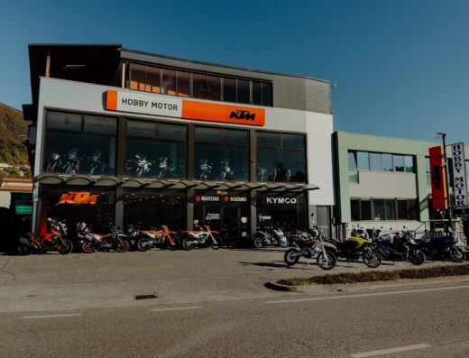 Hobby Motor store exterior featuring KTM, Suzuki and Kymco motorcycles for sale, showcasing a variety of models and brands for motorcycle enthusiasts.