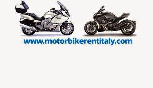 Noleggio moto e tour in Italia a Milano: due motociclette, una BMW K 1600 GT bianca con bauletto e una Ducati Diavel nera, presentate per il servizio di noleggio.