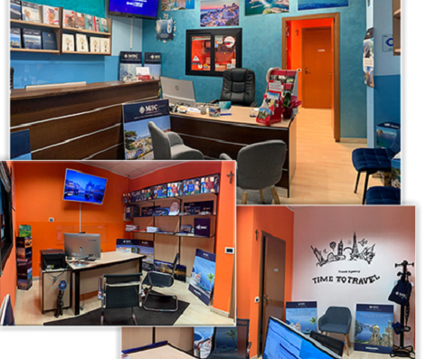 Interno dell'agenzia viaggi I Viaggi del Calabrone di Rotolo Rosario Riccardo, con scrivanie, computer, sedie e decorazioni a tema viaggio.