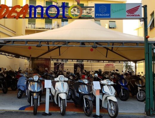 IdeaMoto dealership showcasing a selection of used scooters and motorcycles for sale, featuring brands like Piaggio, Vespa, and Honda.
