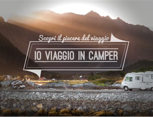Io Viaggio In Camper: un camper bianco su strada costiera rocciosa con montagne sullo sfondo, ideale per viaggi e vacanze avventura.