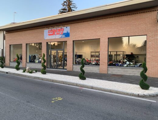 Loreno Race Srl storefront featuring motorcycles and accessories displayed in the windows, showcasing their motorcycle services and marketplace.