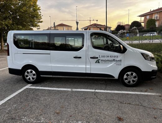 MomoRent white van parked in a parking spot. MomoRent offers automotive rental services in Cheri.