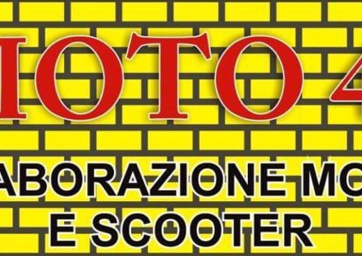 Insegna di Moto 40, specializzati in elaborazioni per moto e scooter, su uno sfondo giallo a mattoni.