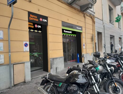 Motor Center storefront featuring Royal Enfield, SYM, and Kawasaki motorcycles. Several motorcycles are parked outside. Motorcycle sales and service.