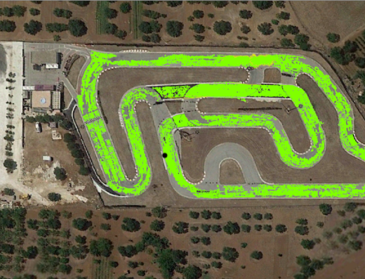 Aerial view of Pista dei Saraceni, a kart racing track with green highlights indicating the racing line, showcasing the track layout and facilities for motorcycle and karting enthusiasts.