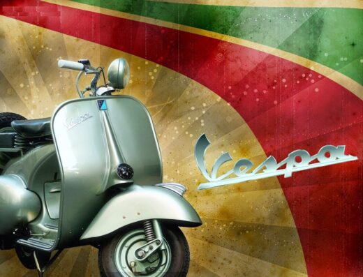 Noleggio Vespa a Roma: dettaglio di Vespa d'epoca color argento con logo Vespa su sfondo decorativo. Servizio di noleggio scooter per esplorare la città.