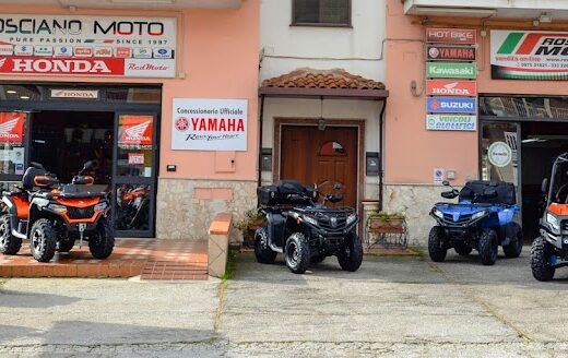 Rosciano Moto dealership showcasing a variety of CF Moto ATVs and UTVs outside their shop, with Honda and Yamaha logos visible.