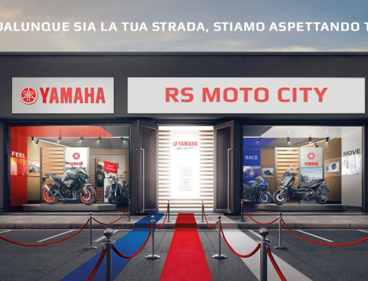 RS Moto City Yamaha dealership storefront featuring Yamaha motorcycles on display, including a Yamaha MT and a scooter, with a red carpet entrance.