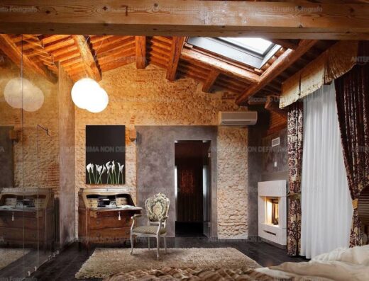 Interno di lusso di Villa Solaris Hotel & Residence con soffitto in legno a vista, pareti in pietra, scrivania antica, camino moderno e arredi eleganti per un soggiorno indimenticabile.