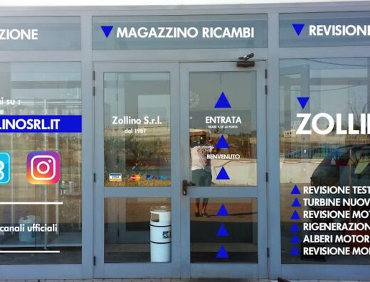 Facciata dell'azienda Zollino S.r.l. specializzata in turbine, motori e ricambi, con vetrine che mostrano i servizi offerti come revisione motori, rigenerazione e vendita di ricambi. L'ingresso è ben segnalato.